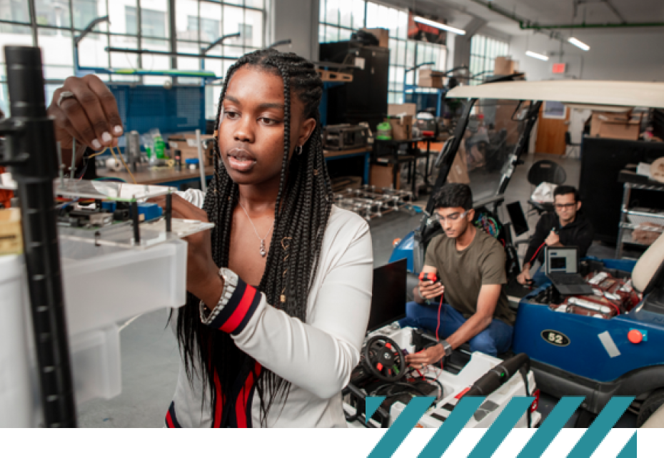 student working with engineering lab equipment