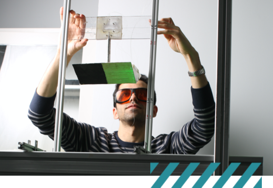 student working wearing lab goggles