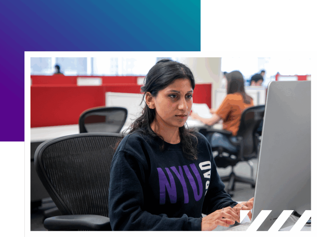 NYU student working at desktop computer